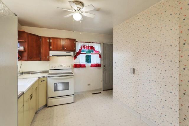 1270 Wetsell Ave, Lancaster, OH 43130 - kitchen with white electric range, range hood, ceiling fan, light countertops, and baseboards