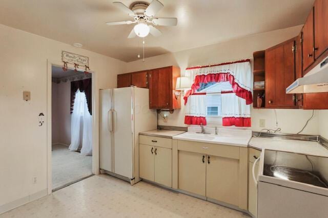 1270 Wetsell Ave, Lancaster, OH 43130 - kitchen featuring freestanding refrigerator, a ceiling fan, stove, a sink, and light countertops