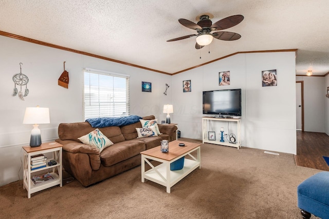 2389 Bluff Run Dr, Grove City, OH 43123 - carpeted living room with ornamental molding, lofted ceiling, a ceiling fan, and a textured ceiling