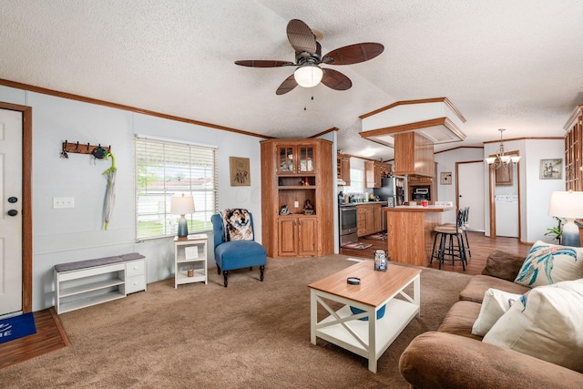 2389 Bluff Run Dr, Grove City, OH 43123 - living area with a ceiling fan, a chandelier, a textured ceiling, crown molding, and carpet floors