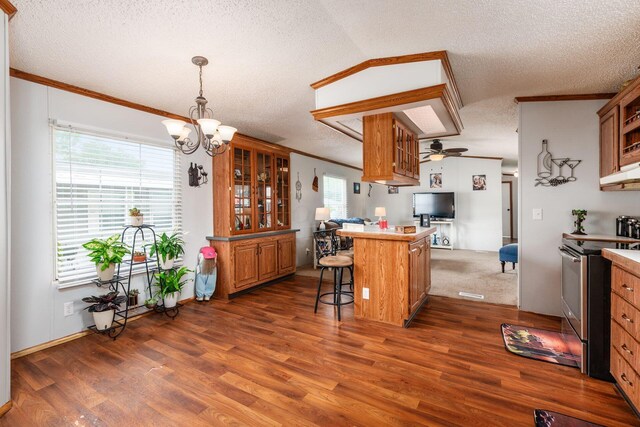 2389 Bluff Run Dr, Grove City, OH 43123 - kitchen with stainless steel electric range oven, open floor plan, a textured ceiling, a breakfast bar area, and brown cabinetry
