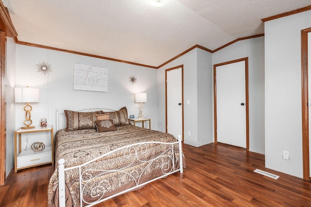 2389 Bluff Run Dr, Grove City, OH 43123 - bedroom with wood finished floors, ornamental molding, a textured ceiling, and lofted ceiling