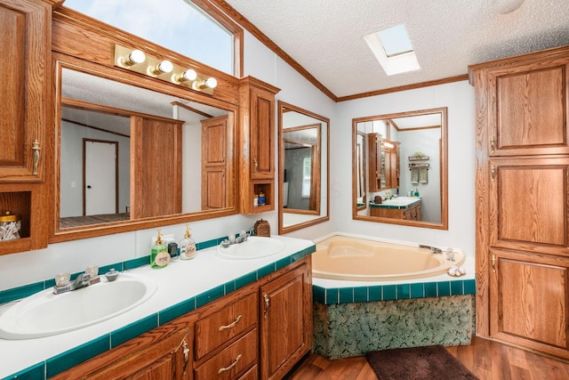 2389 Bluff Run Dr, Grove City, OH 43123 - full bathroom featuring wood finished floors, a skylight, crown molding, double vanity, and a bath