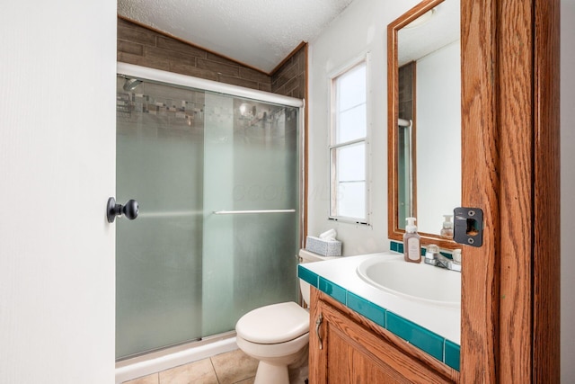 2389 Bluff Run Dr, Grove City, OH 43123 - bathroom featuring vanity, a stall shower, toilet, a textured ceiling, and tile patterned floors