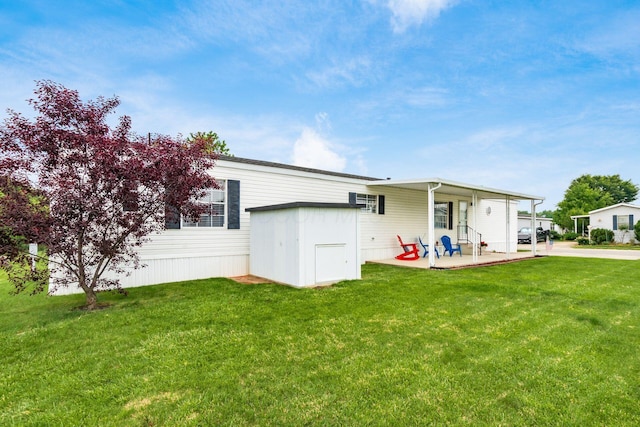 2389 Bluff Run Dr, Grove City, OH 43123 - back of house with a lawn and a patio