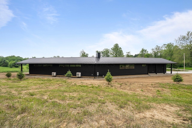 7931 Concord Rd, Johnstown, OH 43031 - rear view of property featuring a metal roof and a chimney