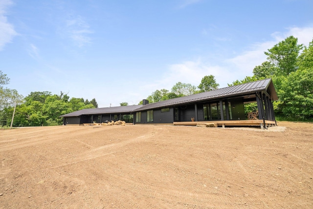 7931 Concord Rd, Johnstown, OH 43031 - view of front of house with driveway, a metal roof, and a chimney