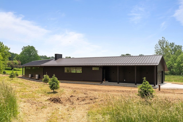7931 Concord Rd, Johnstown, OH 43031 - view of front of property featuring a standing seam roof, a metal roof, and a chimney