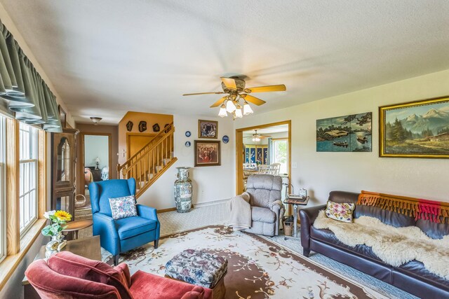 5971 Weaver Rd, Conneaut, OH 44030 - living area with carpet, ceiling fan, and stairway
