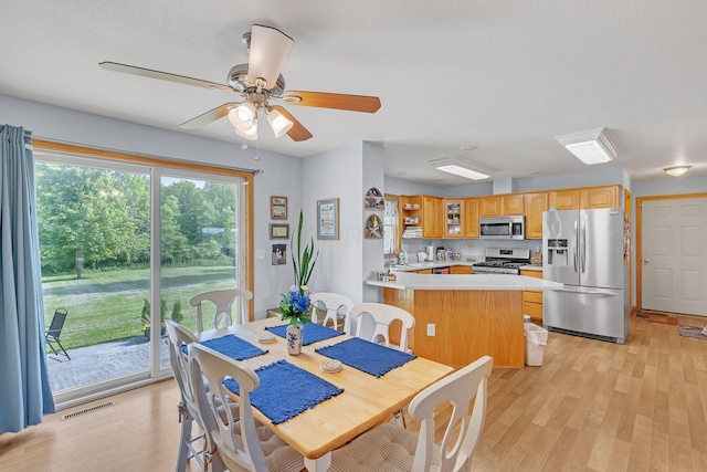 5971 Weaver Rd, Conneaut, OH 44030 - dining room with light wood-style flooring and ceiling fan