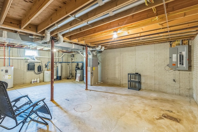 5971 Weaver Rd, Conneaut, OH 44030 - below grade area with electric panel, heating unit, electric water heater, and brick wall