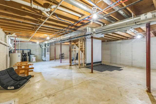 5971 Weaver Rd, Conneaut, OH 44030 - unfinished below grade area with gas water heater, heating unit, and a water softener system