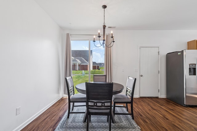 6213 Red Glare Dr Unit 290, Galloway, OH 43119 - dining room featuring a chandelier and dark wood-style flooring
