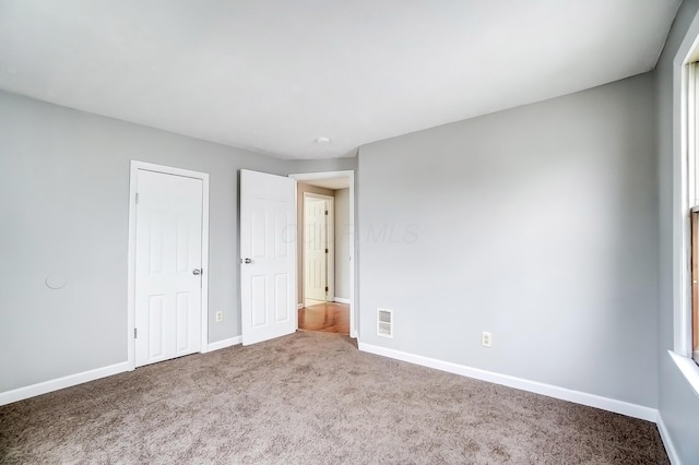 1011 Mcclelland Ave, Columbus, OH 43211 - unfurnished bedroom featuring carpet and baseboards