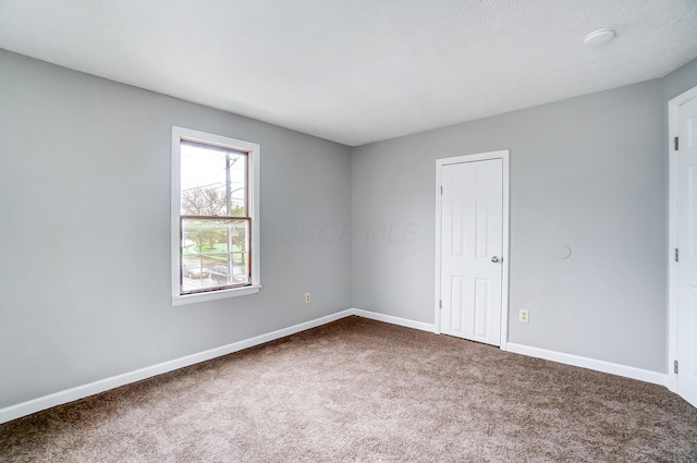 1011 Mcclelland Ave, Columbus, OH 43211 - empty room with carpet and baseboards