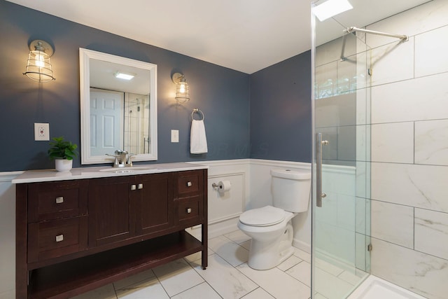 966 Chambers Cir, Columbus, OH 43212 - full bath with tiled shower, vanity, toilet, and a wainscoted wall