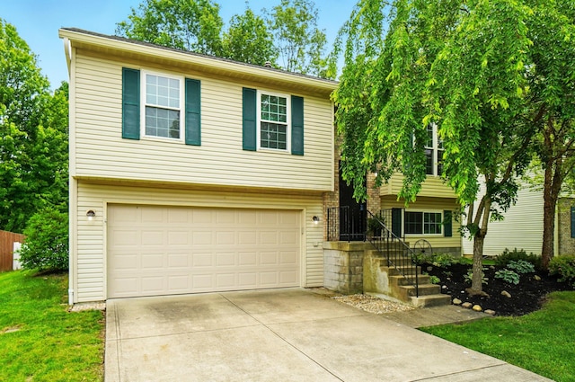 418 Broadview Ct, Pataskala, OH 43062 - view of front facade with concrete driveway, an attached garage, and a front lawn