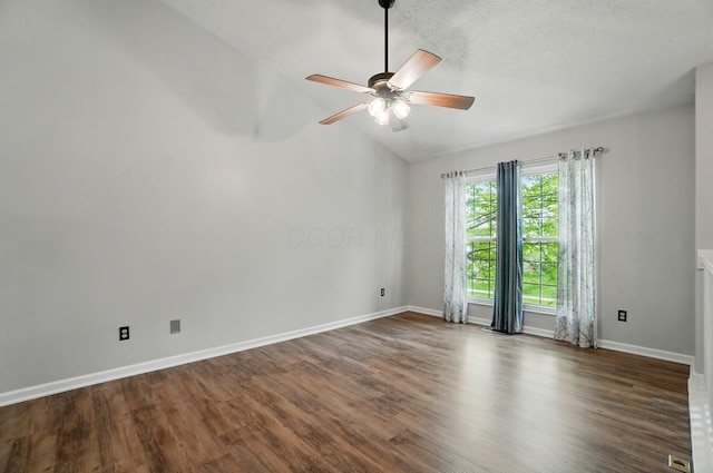 418 Broadview Ct, Pataskala, OH 43062 - empty room with vaulted ceiling, dark wood-style flooring, ceiling fan, and baseboards