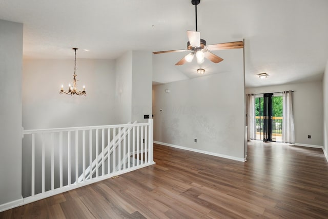 418 Broadview Ct, Pataskala, OH 43062 - unfurnished room featuring wood finished floors, a chandelier, baseboards, and a ceiling fan