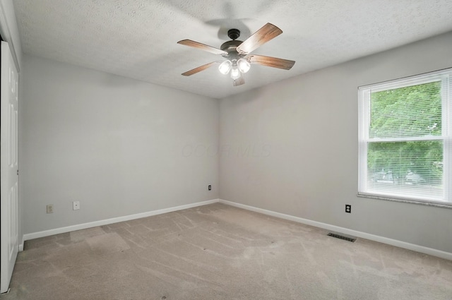 418 Broadview Ct, Pataskala, OH 43062 - unfurnished room featuring ceiling fan, baseboards, light carpet, and a textured ceiling