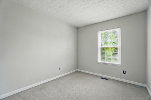418 Broadview Ct, Pataskala, OH 43062 - carpeted spare room with baseboards and a textured ceiling