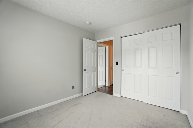 418 Broadview Ct, Pataskala, OH 43062 - unfurnished bedroom featuring carpet floors, baseboards, a textured ceiling, and a closet
