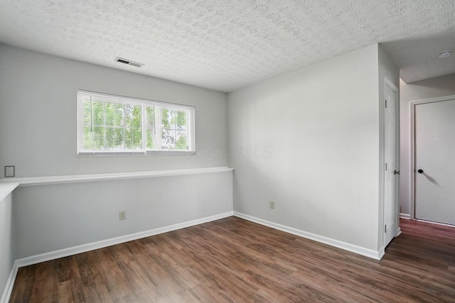 418 Broadview Ct, Pataskala, OH 43062 - unfurnished room with wood finished floors, baseboards, and a textured ceiling