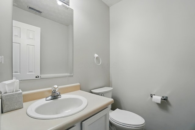 418 Broadview Ct, Pataskala, OH 43062 - bathroom featuring toilet, vanity, and a textured ceiling