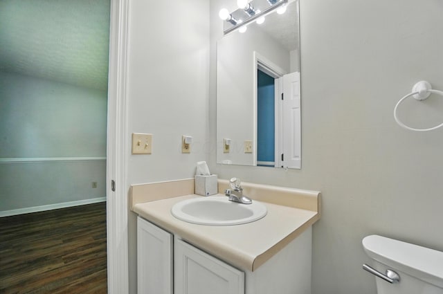 418 Broadview Ct, Pataskala, OH 43062 - half bath with toilet, vanity, wood finished floors, and baseboards