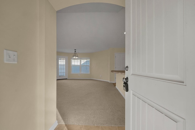 611 Woods Edge Ln, Newark, OH 43055 - corridor with light carpet, baseboards, and arched walkways