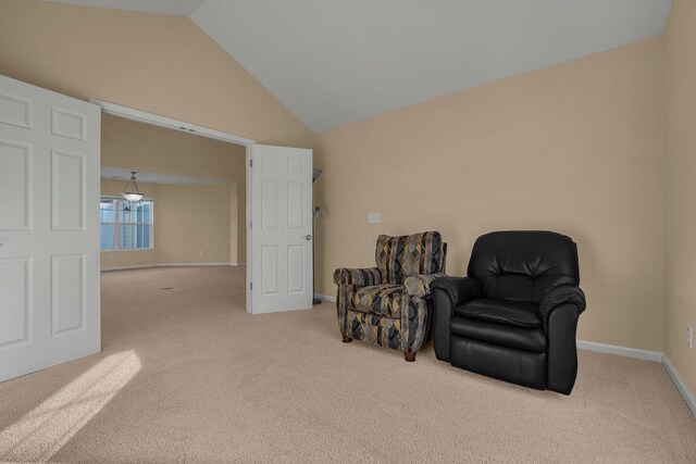 611 Woods Edge Ln, Newark, OH 43055 - living area with carpet floors, vaulted ceiling, and baseboards