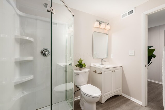 2142 Balford Sq W, Columbus, OH 43232 - bathroom featuring wood finished floors, a shower stall, and vanity