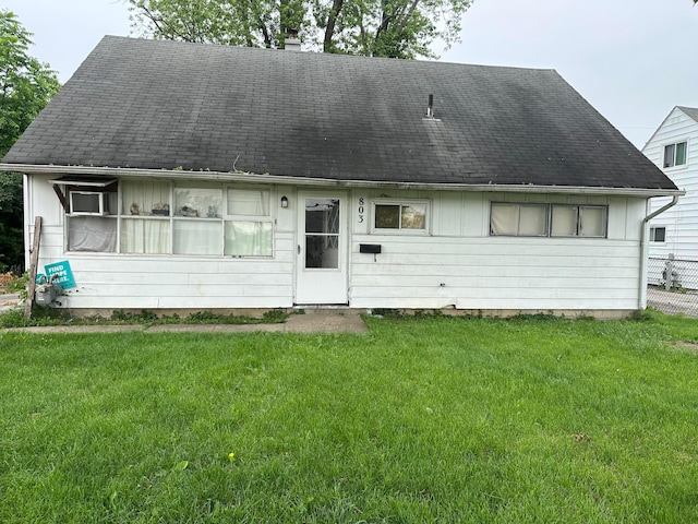 803 Demorest Rd, Columbus, OH 43204 - view of front of house featuring a chimney, a front yard, and roof with shingles