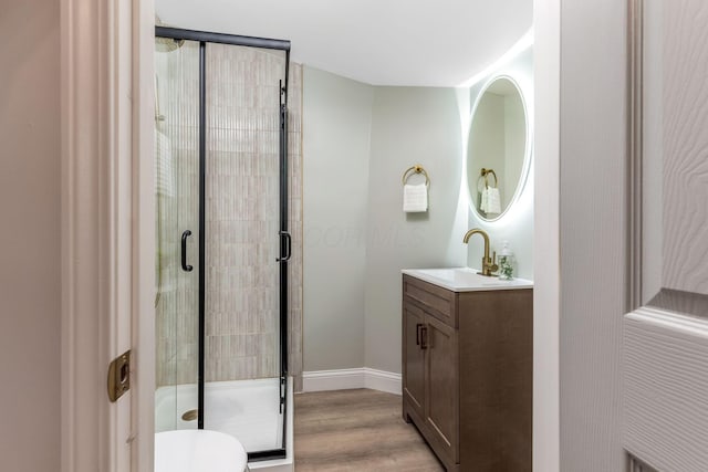 72 Avondale Ave, Columbus, OH 43222 - bathroom featuring vanity, a stall shower, and wood finished floors