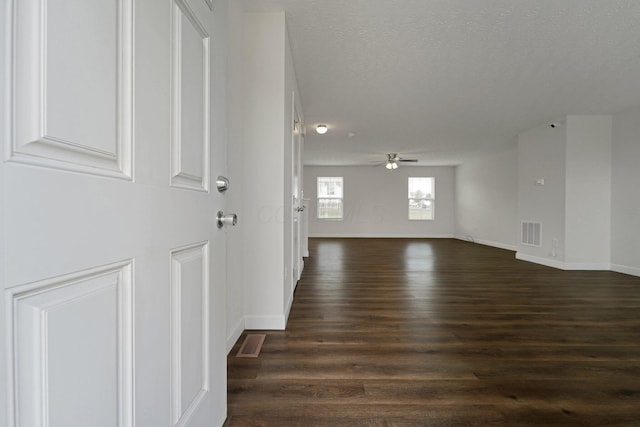 2576 Brook Run Dr, Lancaster, OH 43130 - empty room with dark wood-style floors, baseboards, a ceiling fan, and a textured ceiling