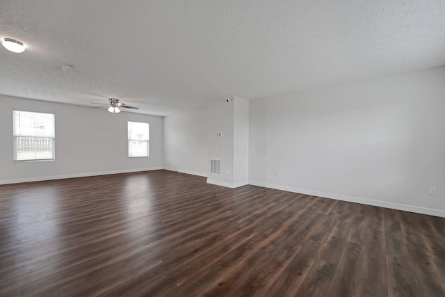 2576 Brook Run Dr, Lancaster, OH 43130 - empty room featuring a textured ceiling, dark wood-style floors, and baseboards