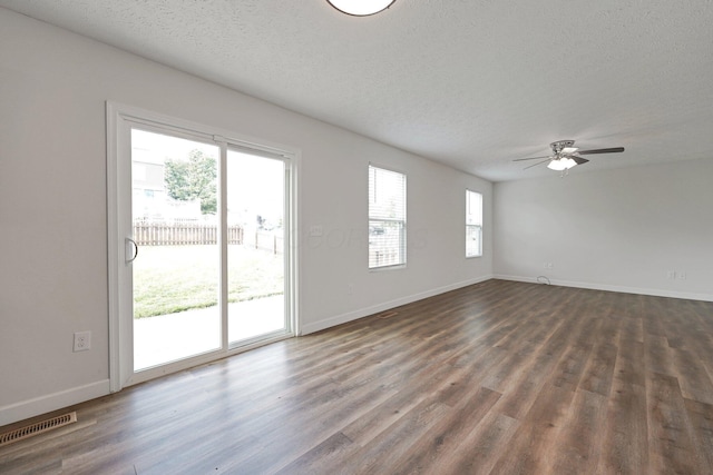 2576 Brook Run Dr, Lancaster, OH 43130 - empty room featuring a textured ceiling, dark wood-style floors, ceiling fan, and baseboards