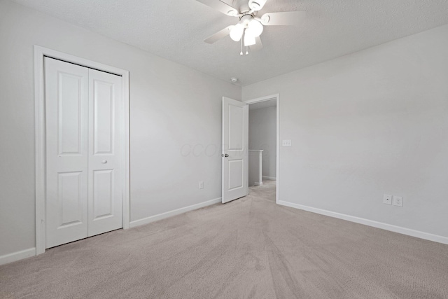 2576 Brook Run Dr, Lancaster, OH 43130 - unfurnished bedroom with light colored carpet, baseboards, a textured ceiling, a closet, and a ceiling fan