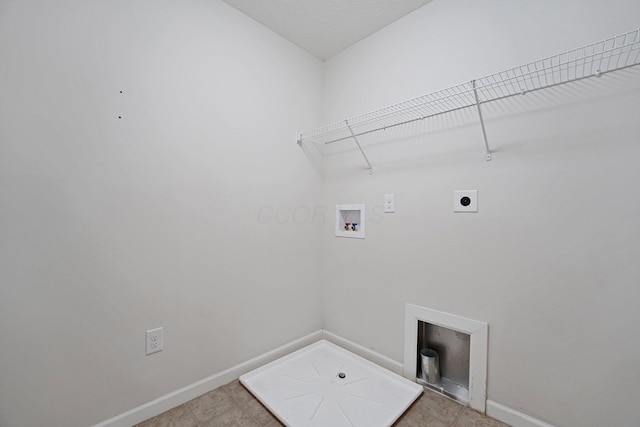 2576 Brook Run Dr, Lancaster, OH 43130 - laundry area with hookup for an electric dryer, washer hookup, baseboards, and light tile patterned flooring
