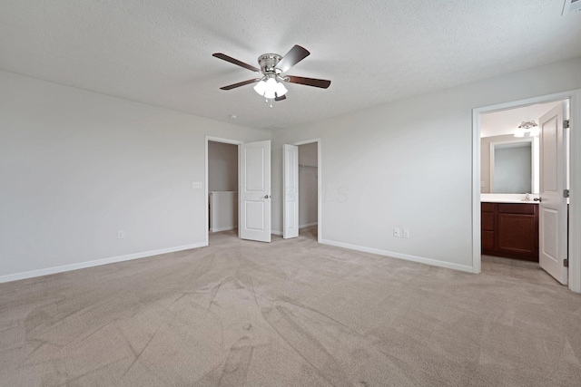 2576 Brook Run Dr, Lancaster, OH 43130 - unfurnished bedroom with light colored carpet, baseboards, a textured ceiling, connected bathroom, and a ceiling fan