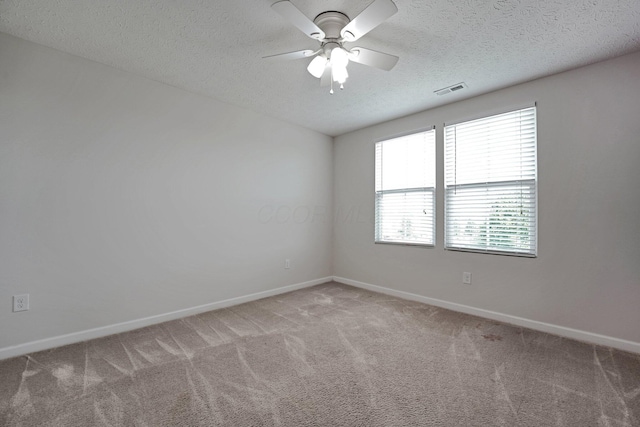 2576 Brook Run Dr, Lancaster, OH 43130 - spare room with light colored carpet, a textured ceiling, baseboards, and ceiling fan