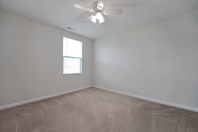2576 Brook Run Dr, Lancaster, OH 43130 - spare room featuring a textured ceiling, baseboards, light colored carpet, and ceiling fan