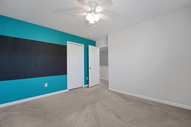 2576 Brook Run Dr, Lancaster, OH 43130 - unfurnished bedroom featuring baseboards, a textured ceiling, carpet floors, a closet, and a ceiling fan