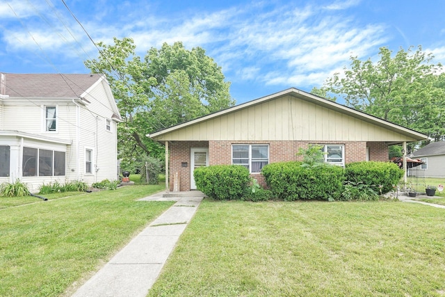 66-64 Eaton St, Delaware, OH 43015 - view of front of house featuring brick siding and a front yard