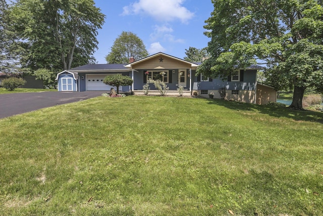 4476 Stiving Rd, Shelby, OH 44875 - ranch-style home featuring a porch, asphalt driveway, an attached garage, a front lawn, and a chimney