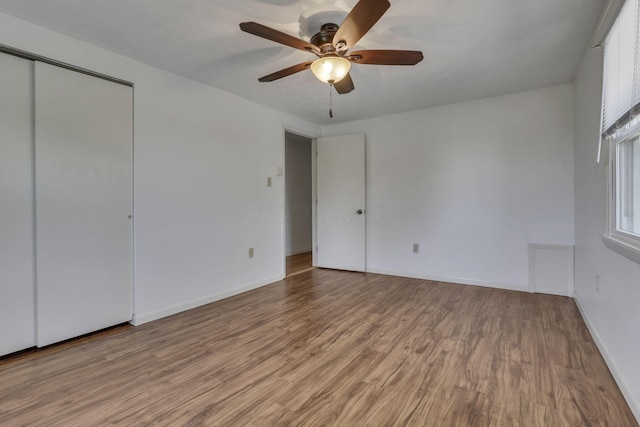 4476 Stiving Rd, Shelby, OH 44875 - unfurnished bedroom with light wood-style floors, a closet, and ceiling fan