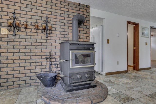 4476 Stiving Rd, Shelby, OH 44875 - detailed view of a wood stove, a textured ceiling, and freestanding refrigerator