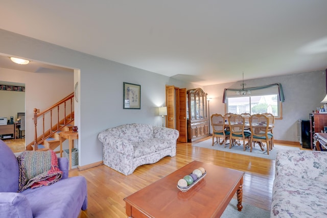 4909 Vanlear Rd, Columbus, OH 43229 - living area featuring stairway, wood finished floors, and baseboards