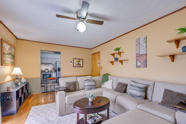4909 Vanlear Rd, Columbus, OH 43229 - living area featuring light wood-type flooring, ceiling fan, and crown molding