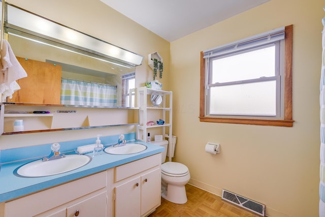 4909 Vanlear Rd, Columbus, OH 43229 - full bath featuring toilet, double vanity, baseboards, and curtained shower